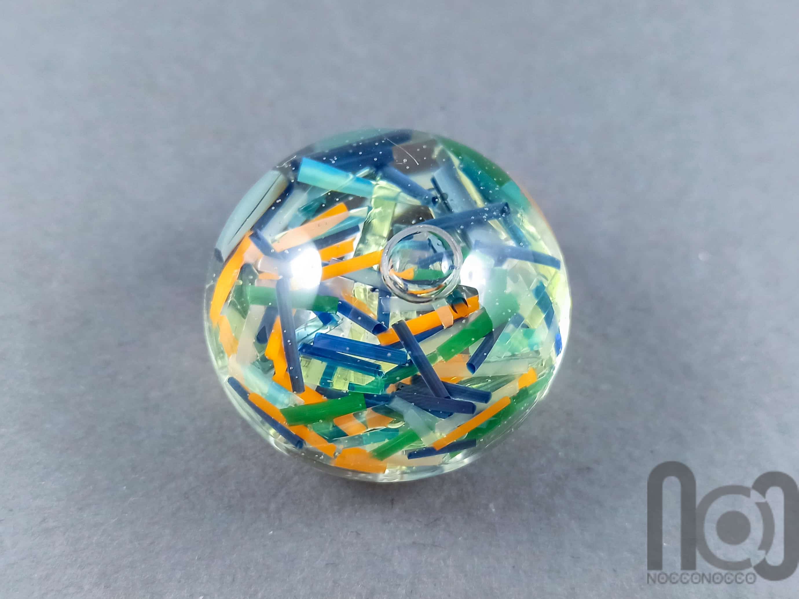 Hollow Glass Marble Filled with Colorful Glass Pieces Floating In Liquid, v292 — handmade borosilicate glass by NoccoNocco, made in Greece