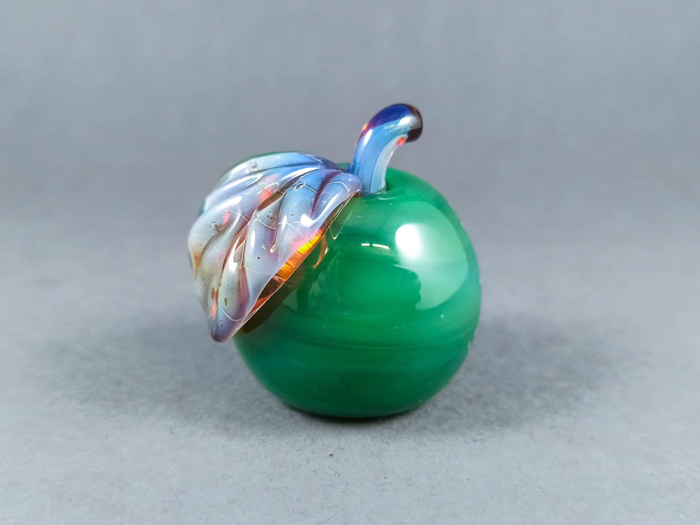 Solid Glass Apple Marble with a Leaf, v265 — handmade borosilicate glass by NoccoNocco, main view, made in Greece