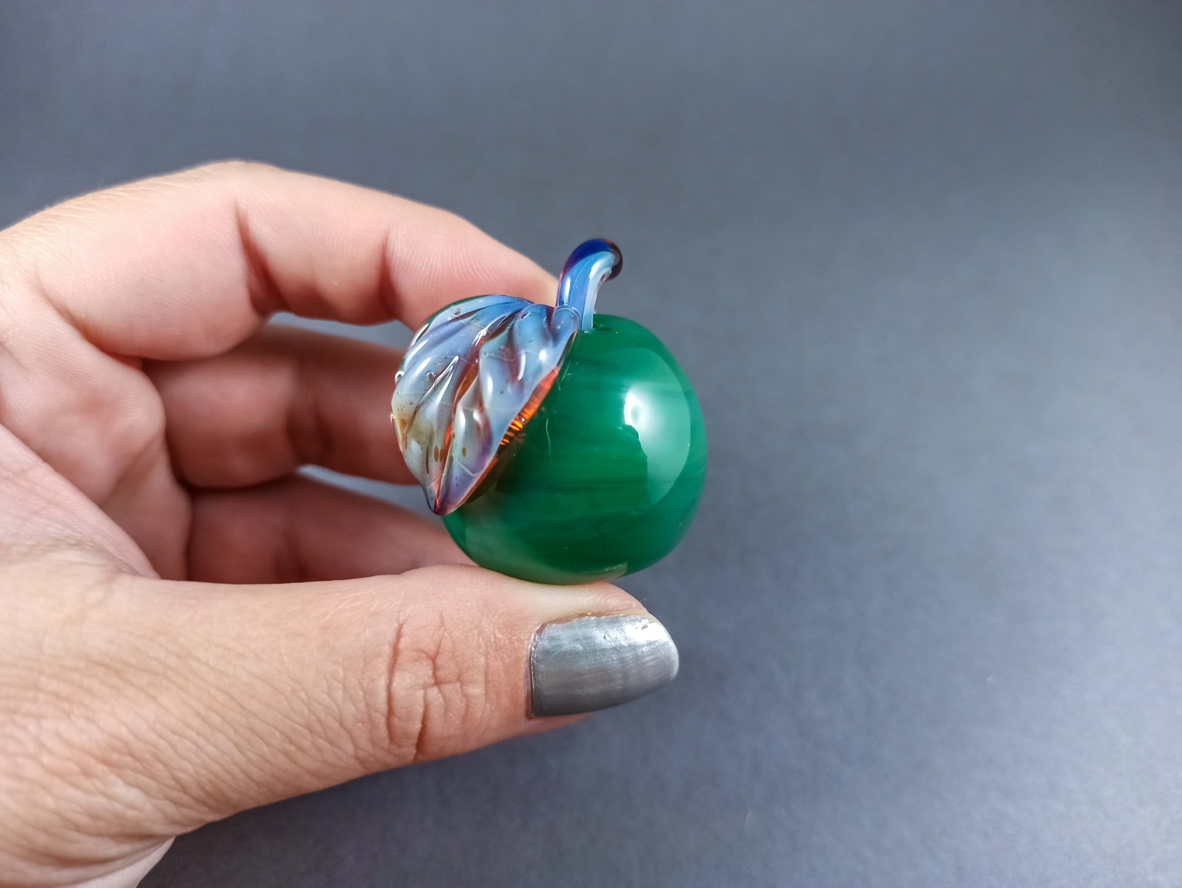 Solid Glass Apple Marble with a Leaf, v265 — handmade borosilicate glass by NoccoNocco, detail view 2 of 4, made in Greece