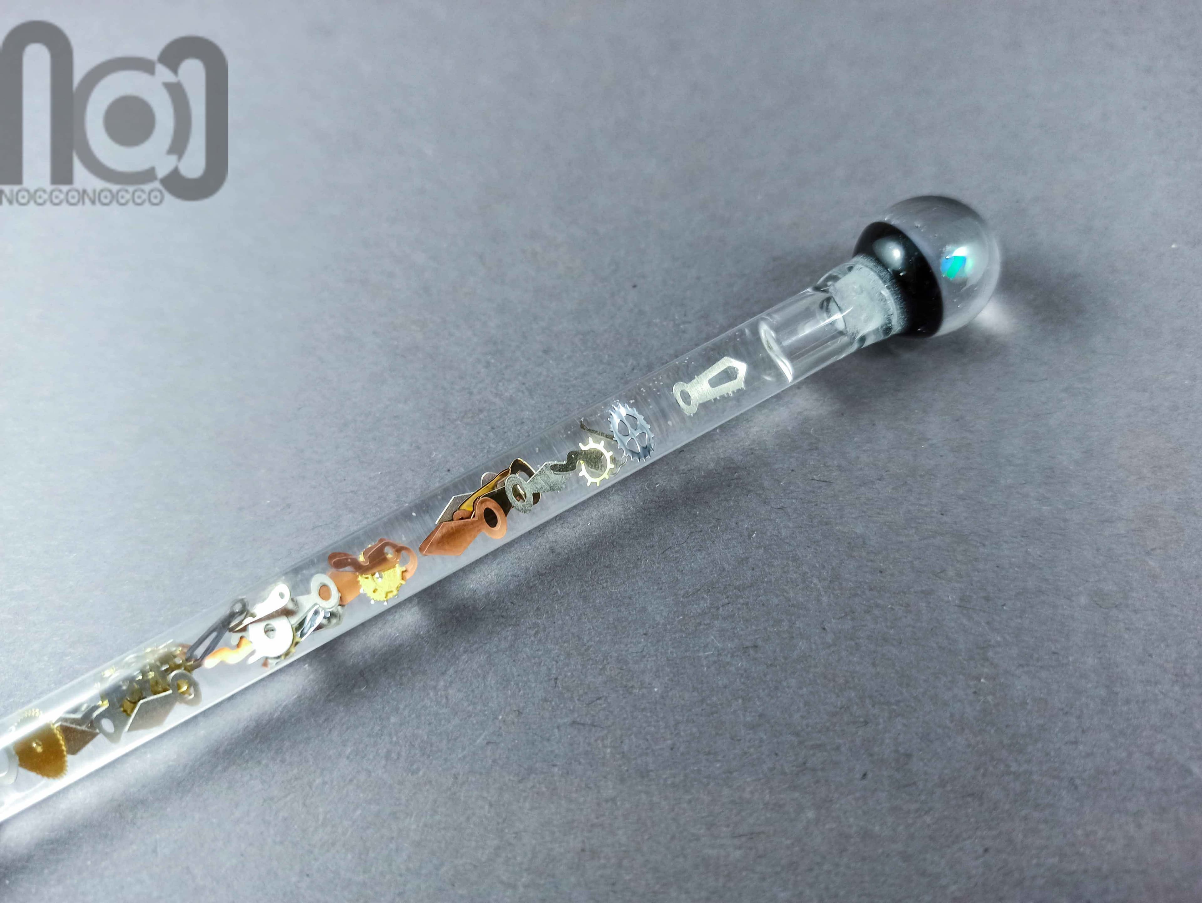 Glass Dip Pen filled with floating cog and gears, and a galaxy marble on top, v045 — handmade borosilicate glass by NoccoNocco, detail view 2 of 4, made in Greece