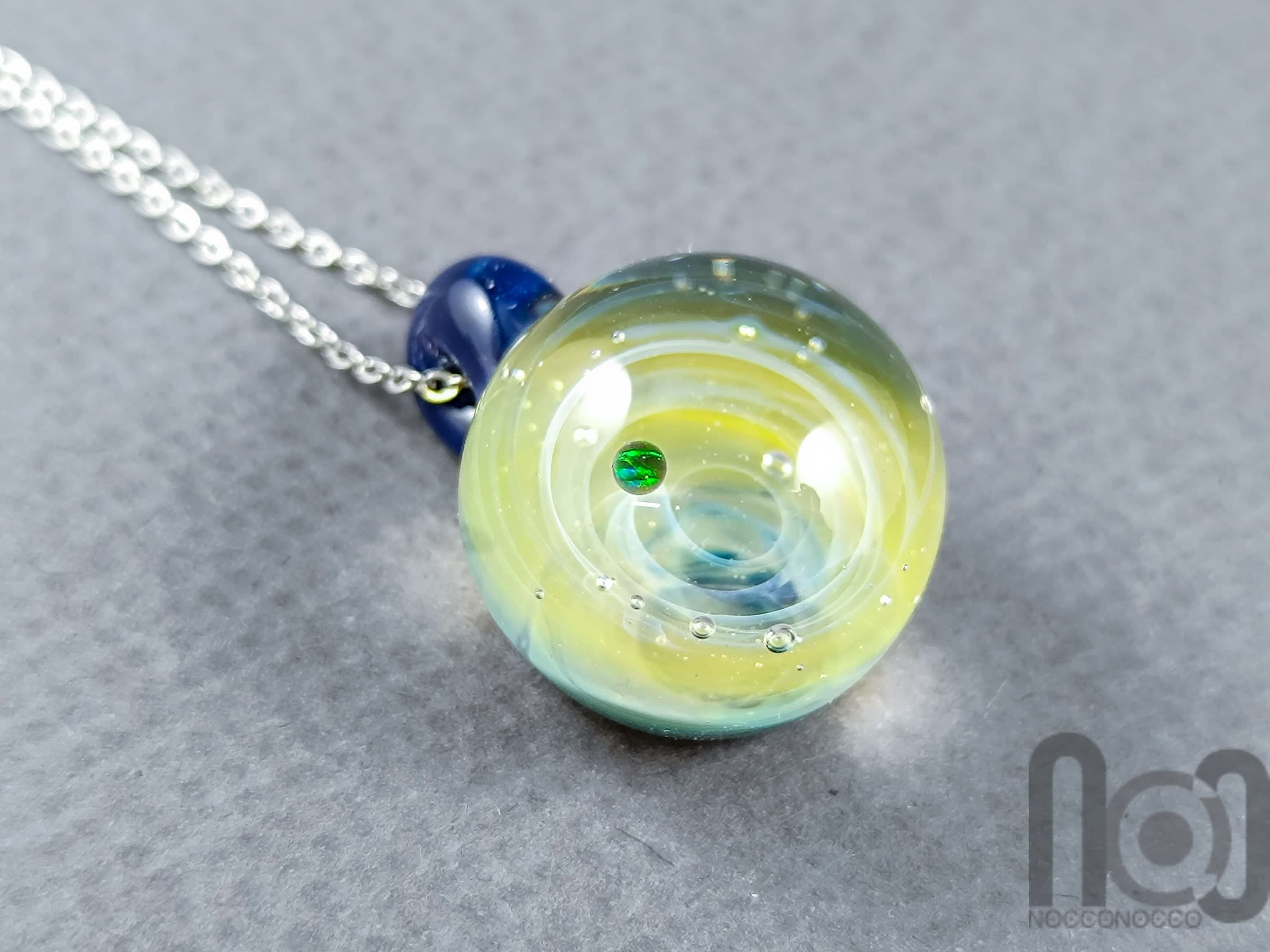 Tiny Galaxy Pendant with an Opal Planet, v299 — handmade borosilicate glass by NoccoNocco, main view, made in Greece