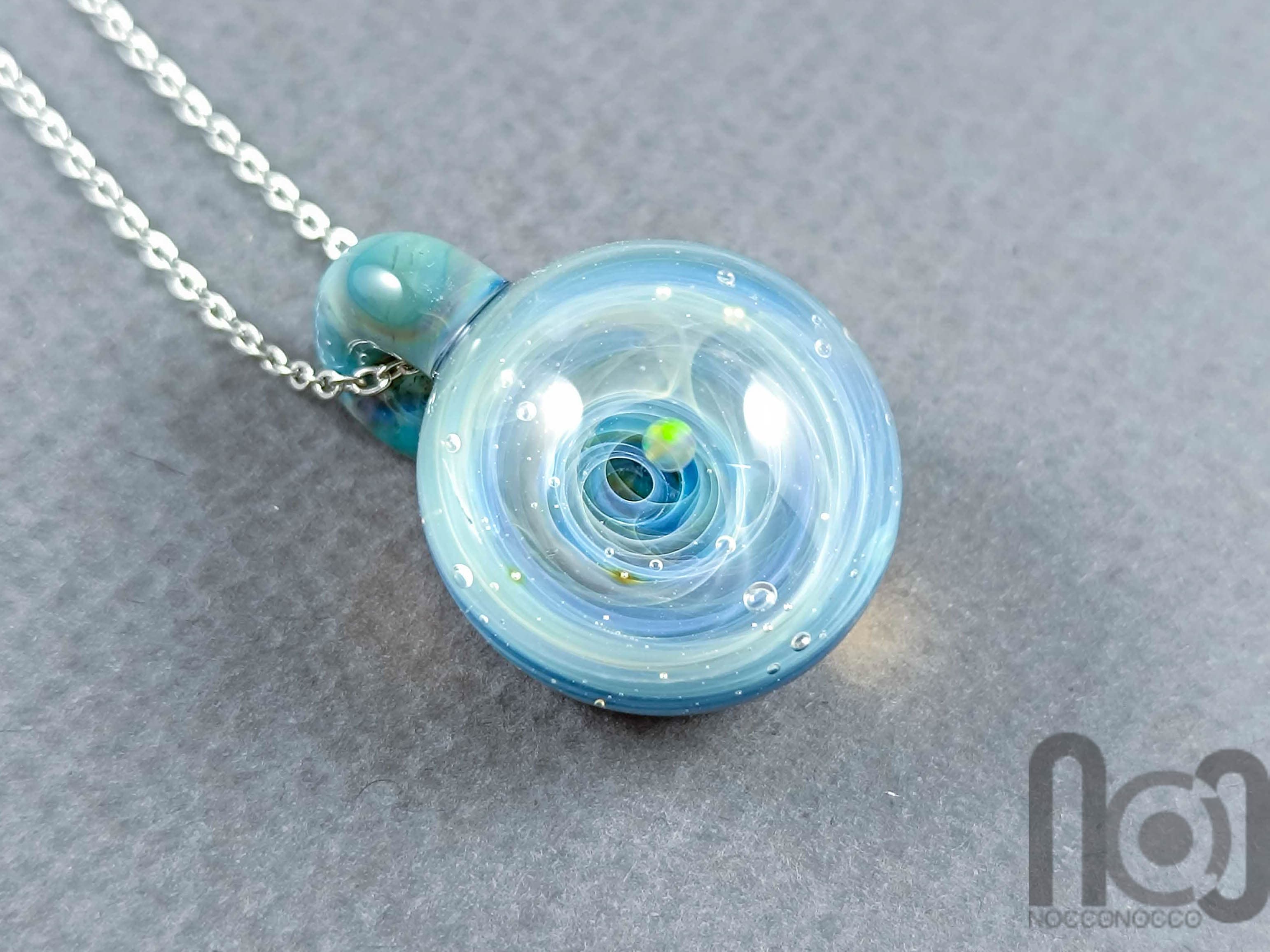 Tiny Galaxy Pendant with an Opal Planet, v300 — handmade borosilicate glass by NoccoNocco, main view, made in Greece