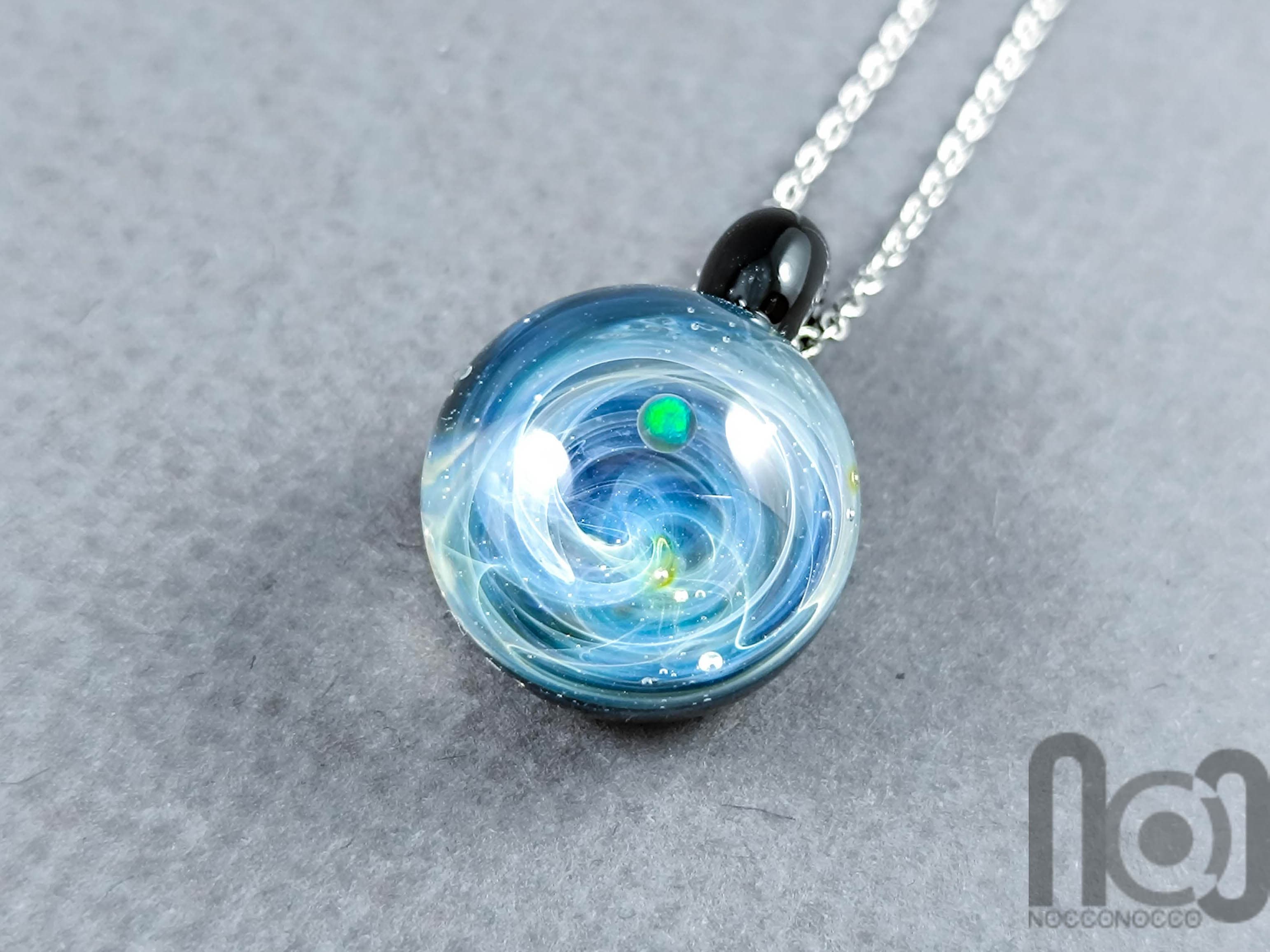 Tiny Galaxy Pendant with an Opal Planet, v304 — handmade borosilicate glass by NoccoNocco, main view, made in Greece