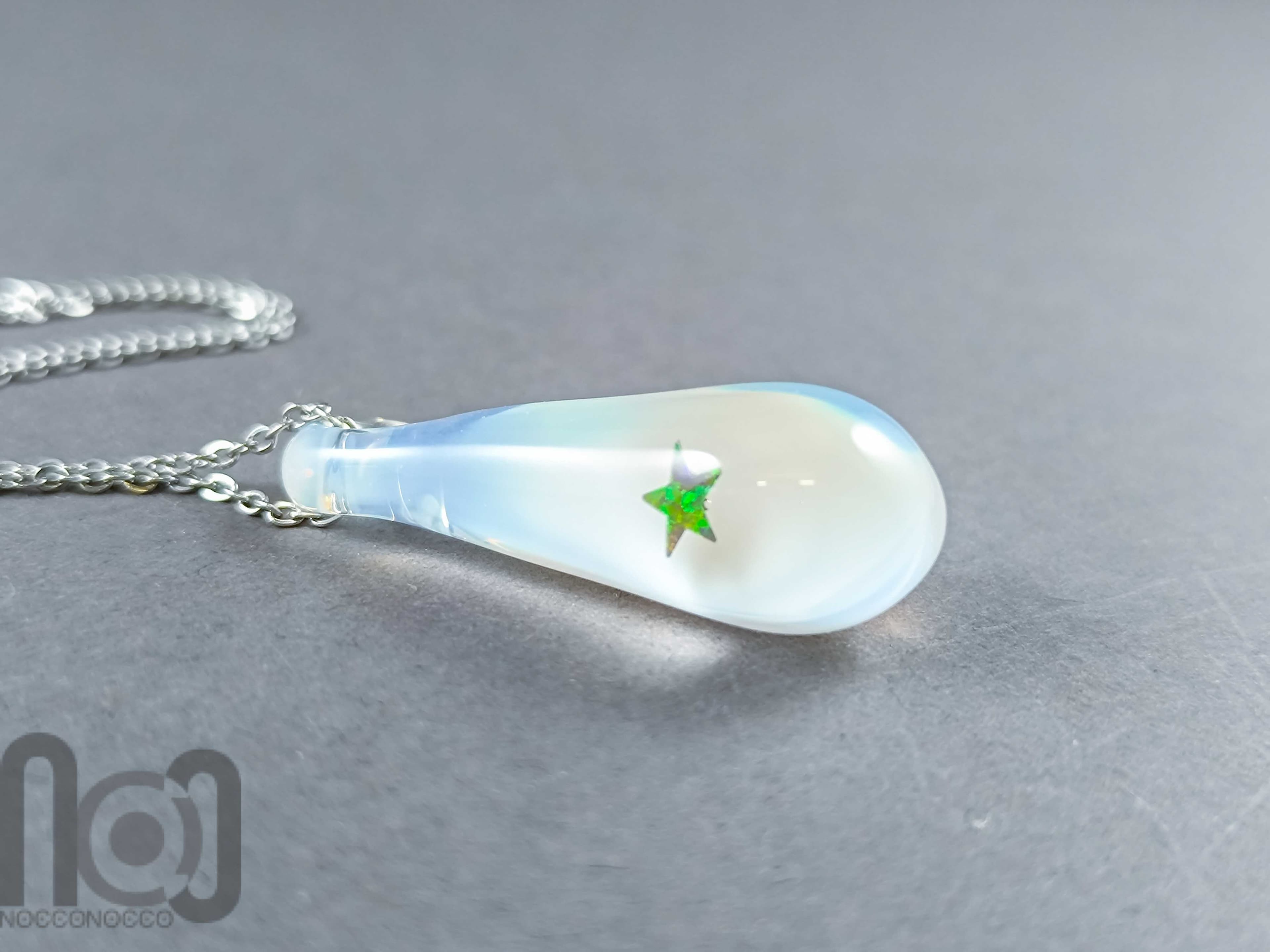 Handmade Glass Pendant with Star-Shaped Opal and Ghost White Background — handmade borosilicate glass by NoccoNocco, main view, made in Greece
