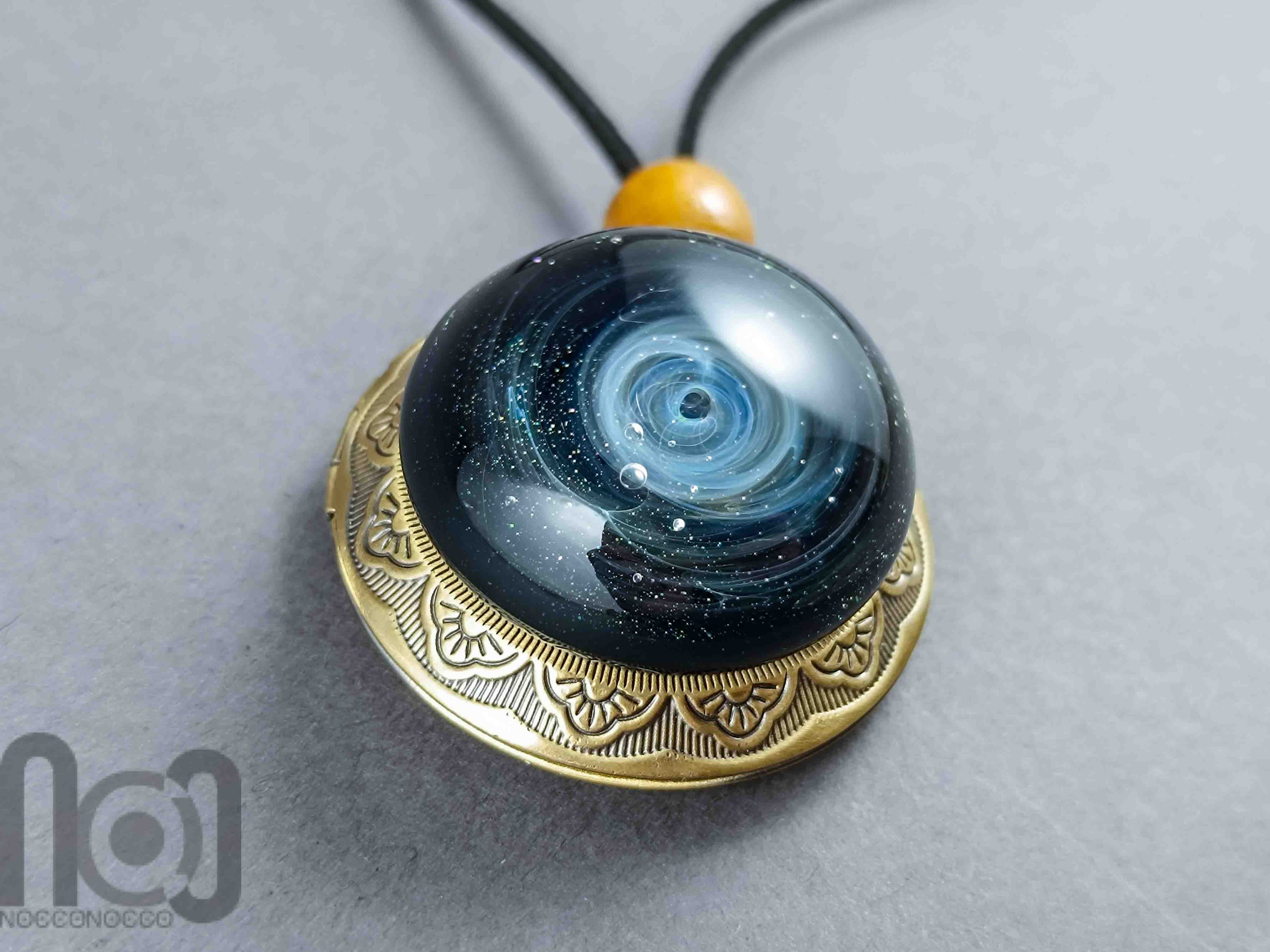 Silver-Fumed Galaxy Glass Pendant on Bronze Locket, v384 — handmade borosilicate glass by NoccoNocco, main view, made in Greece