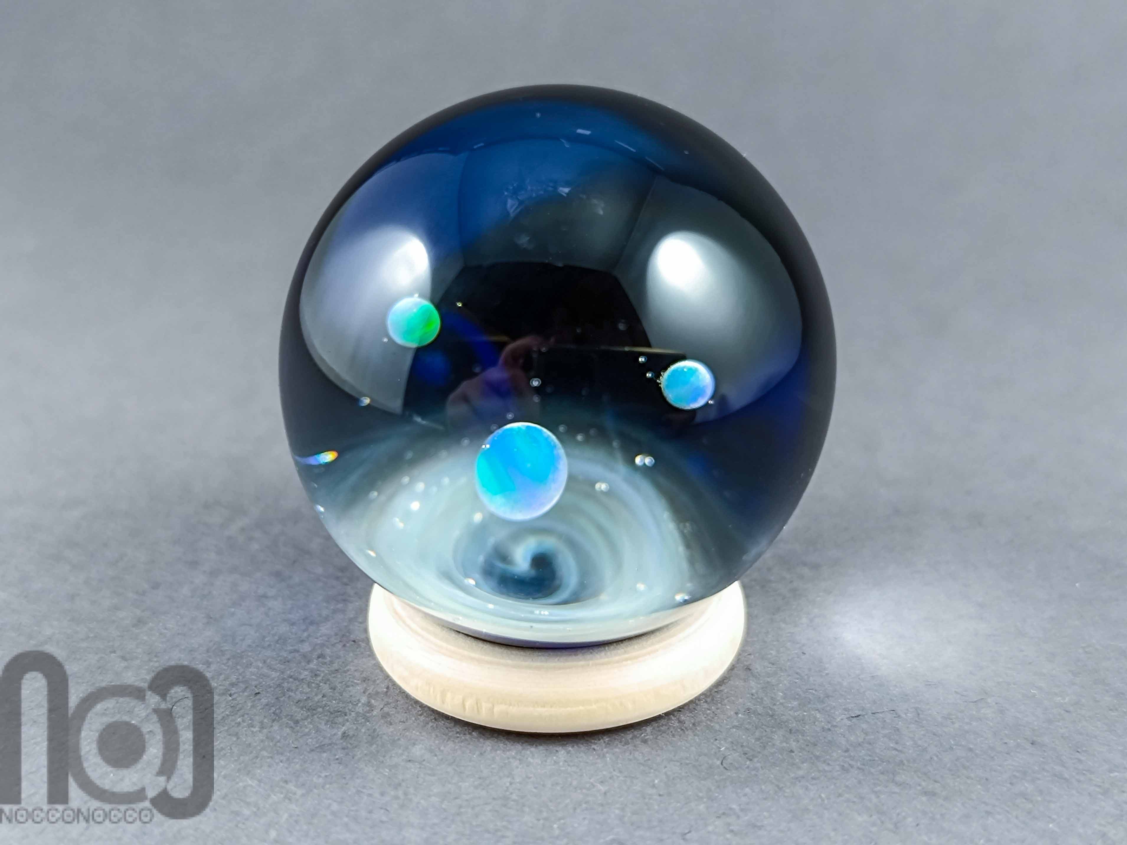 Galaxy Marble with 3 Floating Opal Planets and Decorated Backside, v573 — handmade borosilicate glass by NoccoNocco, detail view 2 of 6, made in Greece
