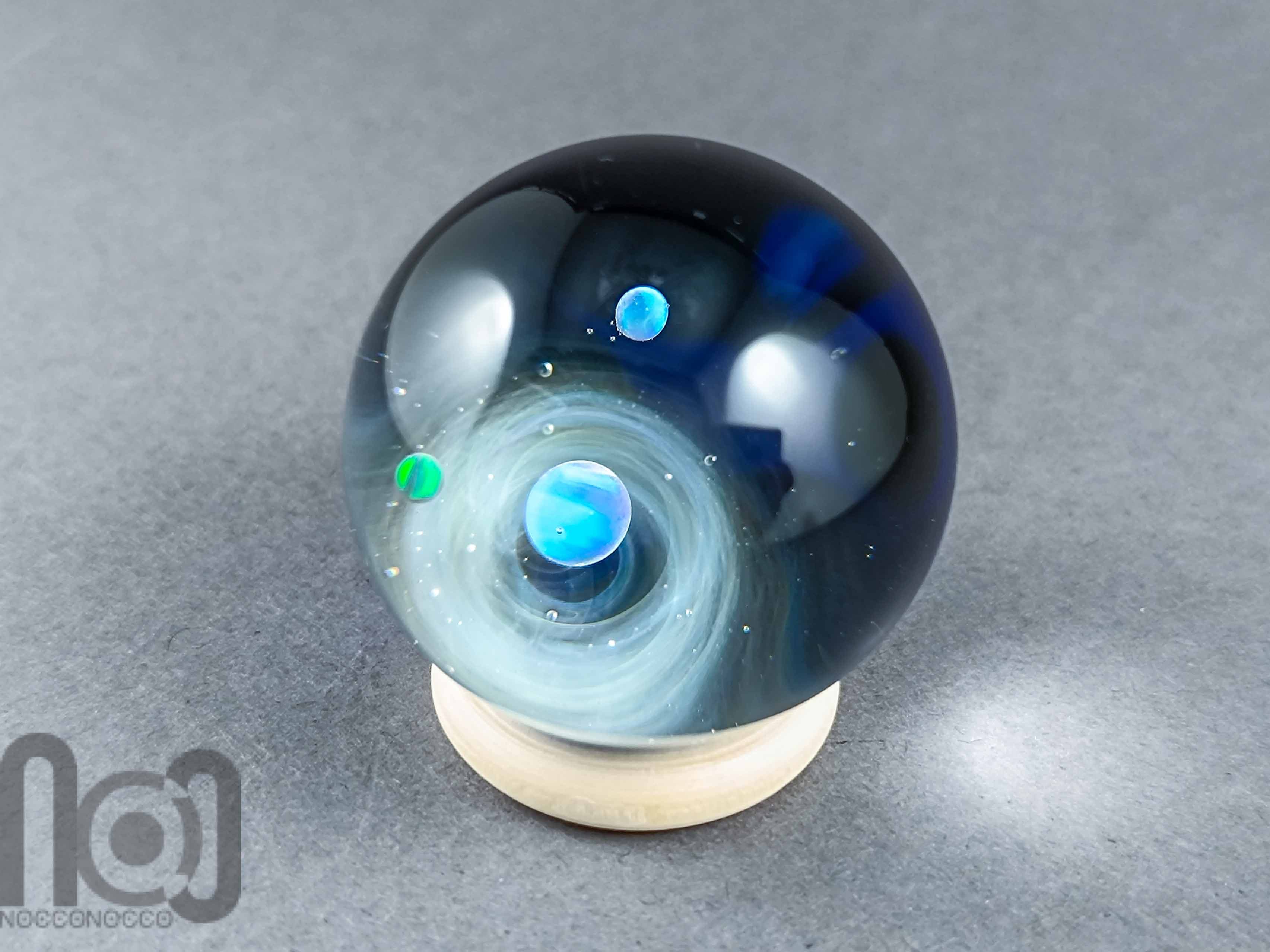 Galaxy Marble with 3 Floating Opal Planets and Decorated Backside, v573 — handmade borosilicate glass by NoccoNocco, detail view 4 of 6, made in Greece
