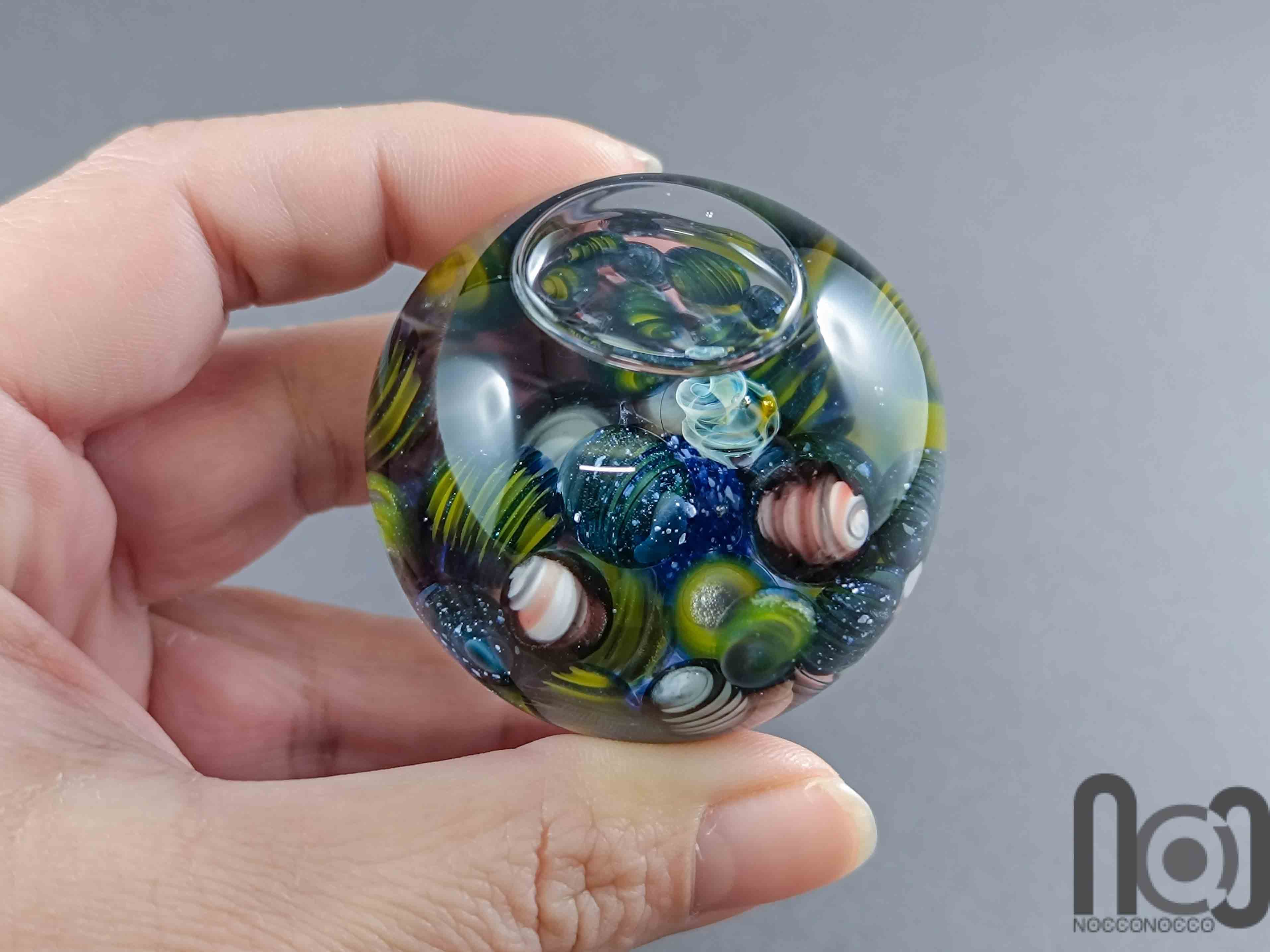 Glycerin-Filled Handmade Glass Marble with Floating Mini Marbles, v590 — handmade borosilicate glass by NoccoNocco, detail view 2 of 5, made in Greece