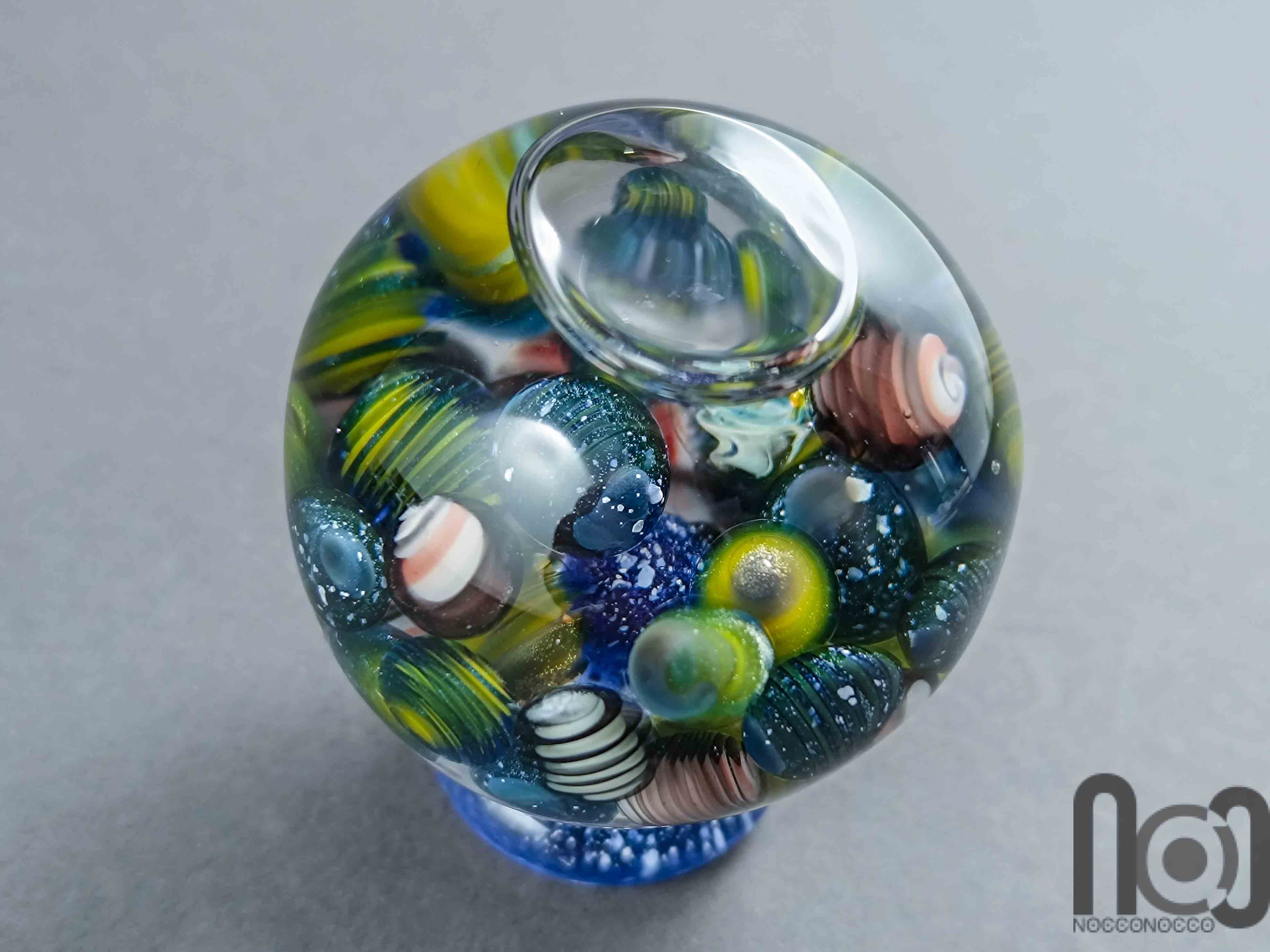 Glycerin-Filled Handmade Glass Marble with Floating Mini Marbles, v590 — handmade borosilicate glass by NoccoNocco, detail view 3 of 5, made in Greece