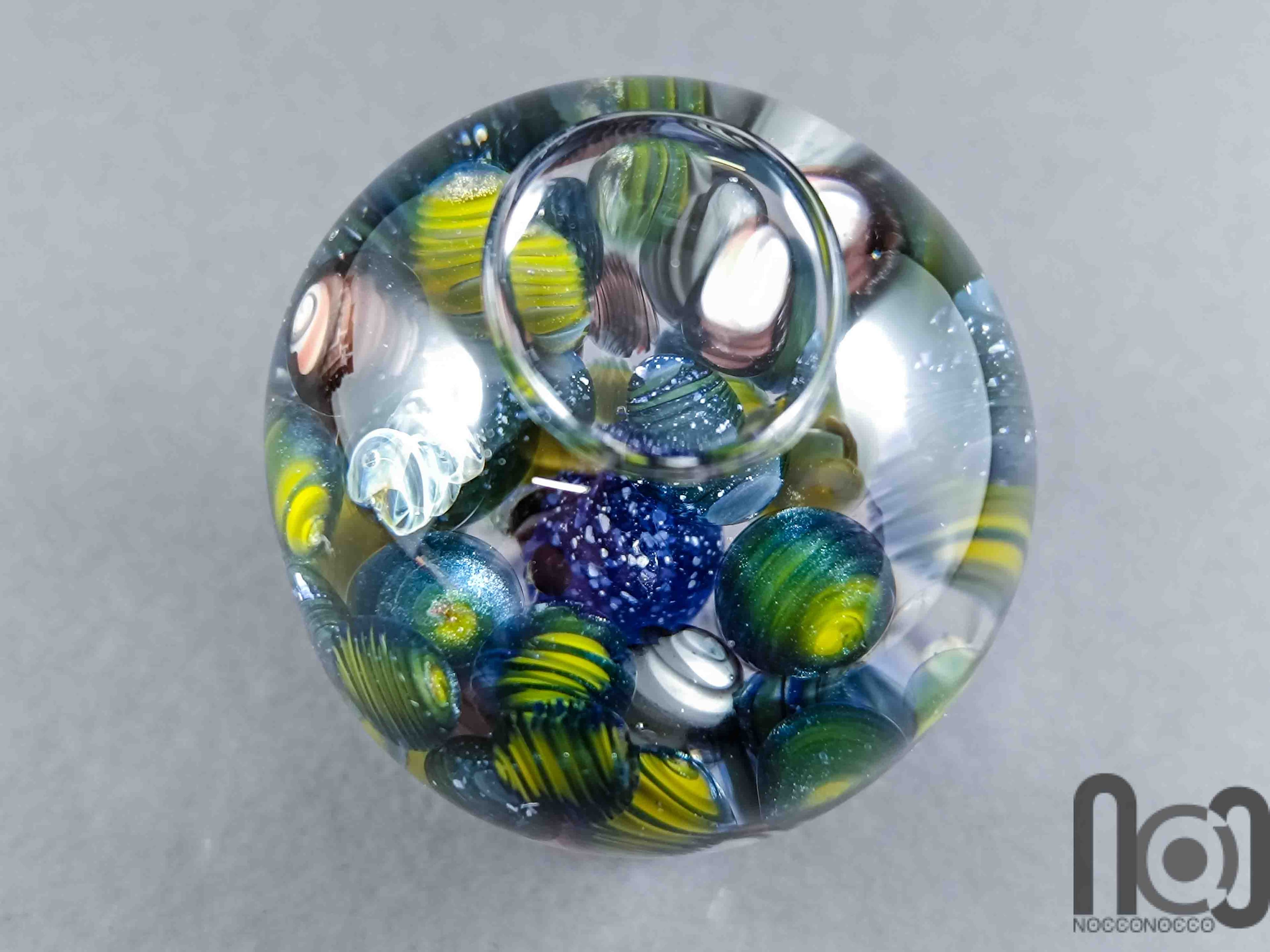 Glycerin-Filled Handmade Glass Marble with Floating Mini Marbles, v590 — handmade borosilicate glass by NoccoNocco, detail view 4 of 5, made in Greece