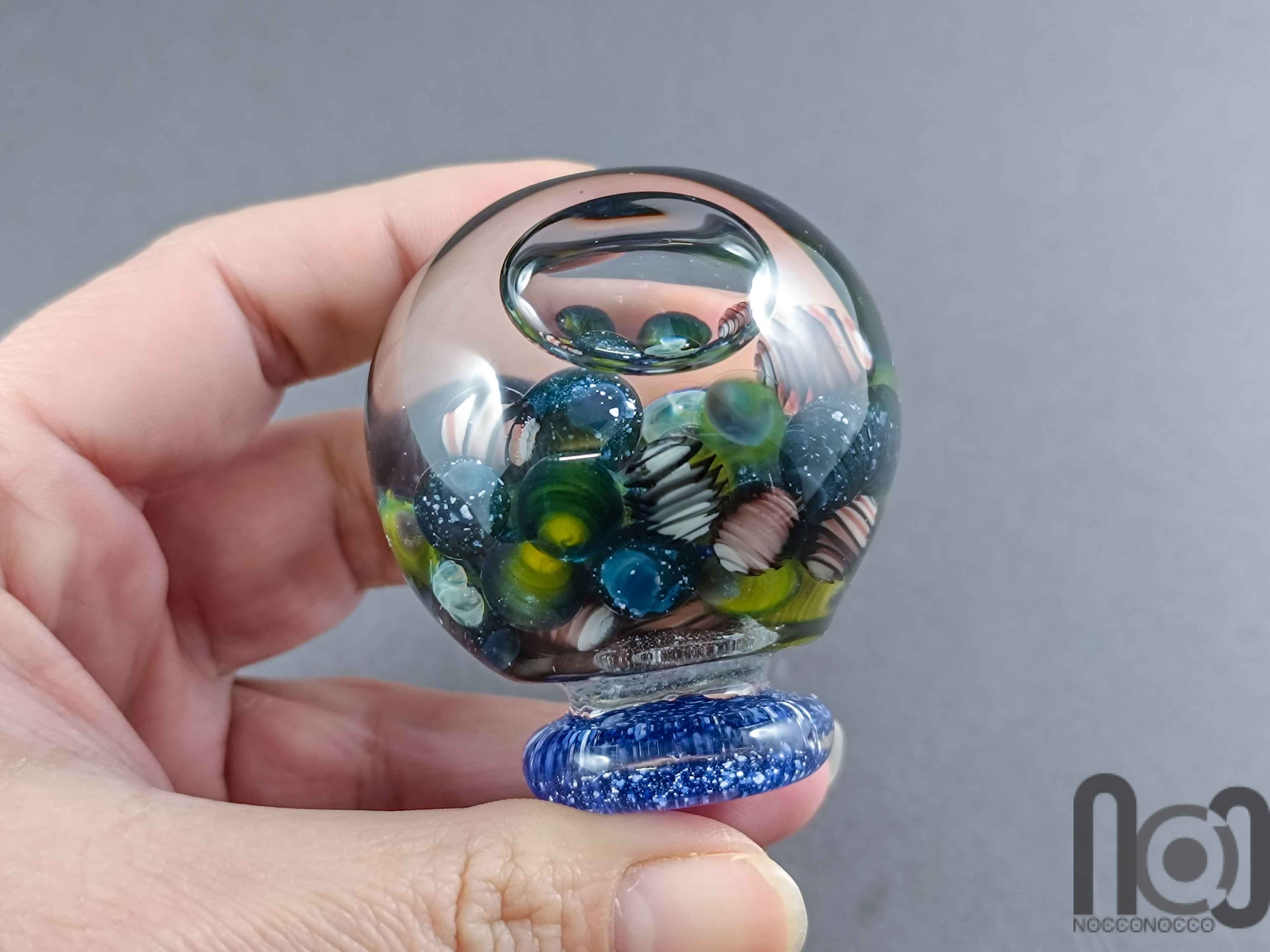 Glycerin-Filled Handmade Glass Marble with Floating Mini Marbles, v590 — handmade borosilicate glass by NoccoNocco, detail view 5 of 5, made in Greece