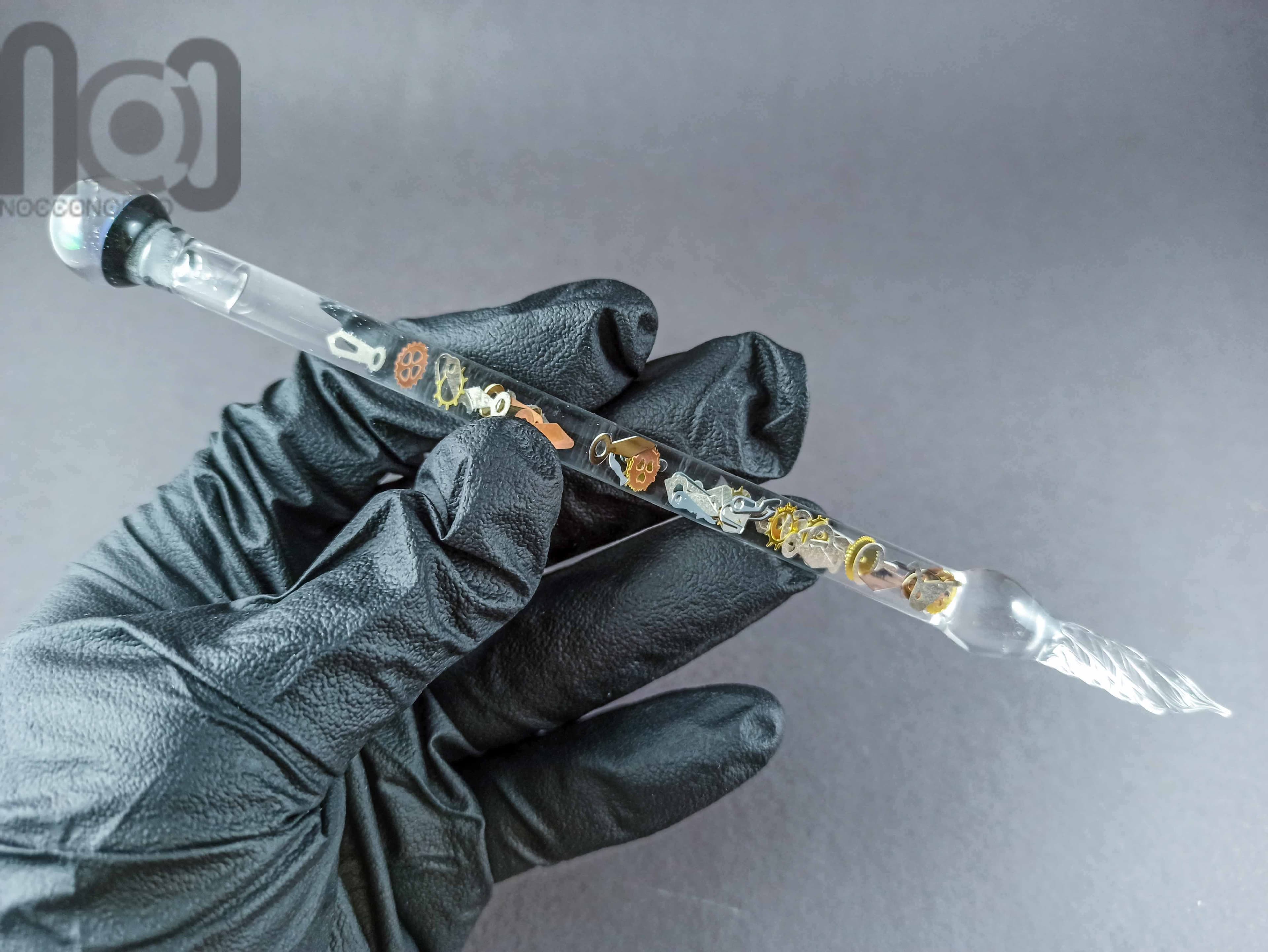 Glass Dip Pen filled with floating cog and gears, and a galaxy marble on top, v045 — handmade borosilicate glass by NoccoNocco, detail view 4 of 4, made in Greece