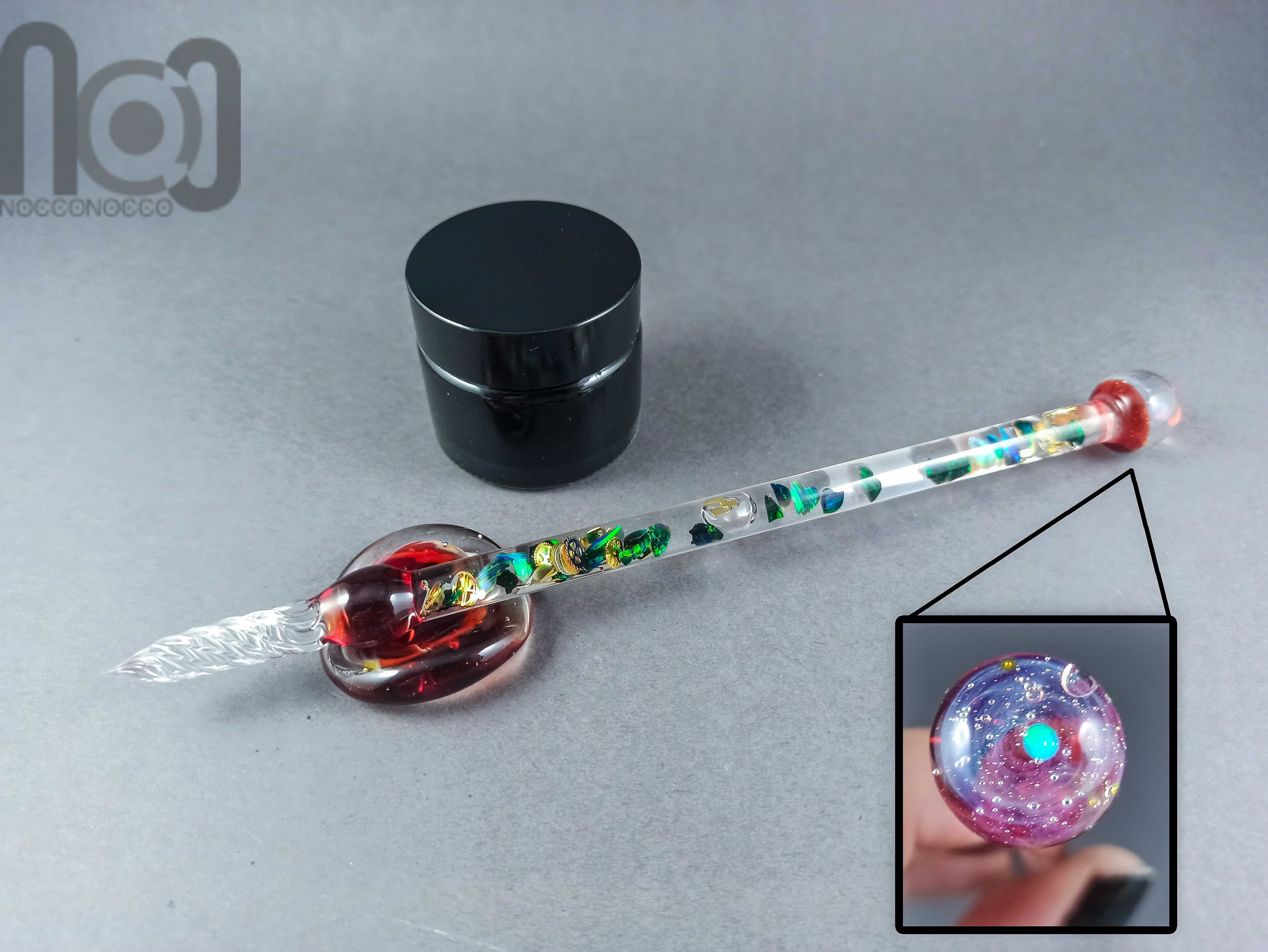 Glass Dip Pen filled with floating cog and gears, crushed tumbled opal, and a galaxy marble on top, v047 — handmade borosilicate glass by NoccoNocco, main view, made in Greece